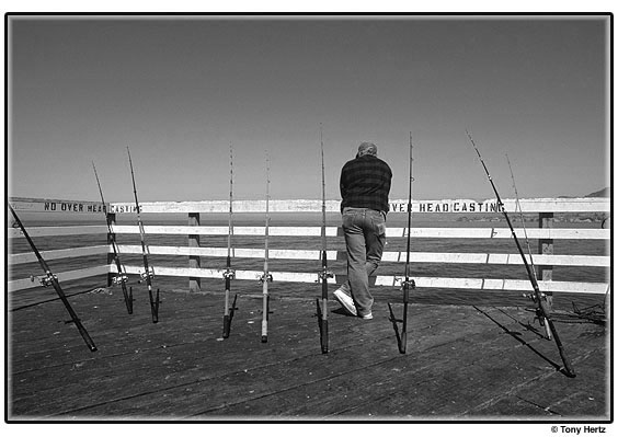 Fisherman with multiple poles.